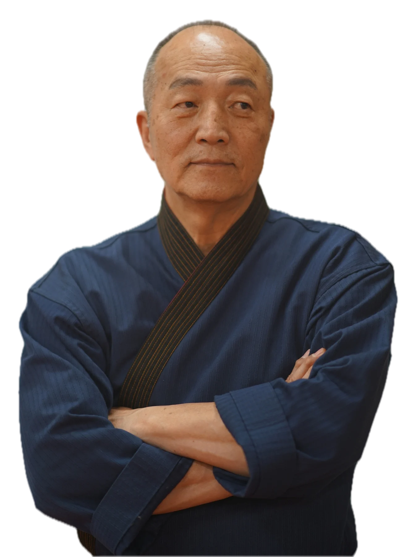Grand Master Won Kuk Kim in his navy dobok, arms crossed
